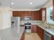 Well-equipped kitchen featuring stainless steel appliances, granite countertops, and lots of cabinetry at 5473 Animosh Ct, Polk City, FL 33868