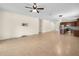 Spacious living area open to the kitchen, featuring tile floors and modern lighting at 5473 Animosh Ct, Polk City, FL 33868