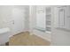 Bright mudroom with tile flooring, hall tree with seating and storage, and access to the house and garage at 5473 Animosh Ct, Polk City, FL 33868
