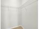 Walk-in closet featuring ample wire shelving for storage, with tile flooring at 5473 Animosh Ct, Polk City, FL 33868