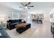 Open-concept living space flowing into the dining area with modern decor, neutral colors, and great natural light at 5712 Bristleleaf Ct, Leesburg, FL 34748