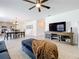 Comfortable living area with stylish furnishings, natural lighting, and seamless connection to the dining area and kitchen at 5712 Bristleleaf Ct, Leesburg, FL 34748