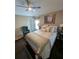 Comfortable bedroom with ceiling fan, dark wood floors, and a queen size bed at 5921 Lake Champlain Dr, Orlando, FL 32829