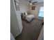Cozy bedroom featuring carpet flooring, a ceiling fan, and a comfortable queen-sized bed at 5921 Lake Champlain Dr, Orlando, FL 32829