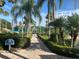 Landscaped community path leading to a gazebo, swimming pool and restrooms at 5921 Lake Champlain Dr, Orlando, FL 32829