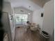 Bright eat-in kitchen features a glass table and chairs next to a large window at 5921 Lake Champlain Dr, Orlando, FL 32829