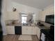 Beautiful kitchen with granite countertops, neutral cabinets and open view to the living area at 5921 Lake Champlain Dr, Orlando, FL 32829