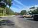 Well-maintained parking lot surrounded by lush landscaping and palm trees, offering ample space for residents and visitors at 5921 Lake Champlain Dr, Orlando, FL 32829