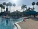 Resort-style community pool with lounge chairs, cabana, and lighthouse, offering a luxurious experience for residents at 5921 Lake Champlain Dr, Orlando, FL 32829