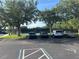 Community tennis court surrounded by mature trees, offering recreational opportunities for residents at 5921 Lake Champlain Dr, Orlando, FL 32829