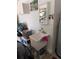 Garage utility sink and cabinets for storage next to a large water heater at 5921 Lake Champlain Dr, Orlando, FL 32829