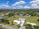 High aerial view showing the property layout, including homes, garages, and extensive land at 6555 Bay Tree Ct, St Cloud, FL 34771