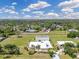 Aerial view showcasing the property, neighboring homes, and surrounding landscape at 6555 Bay Tree Ct, St Cloud, FL 34771