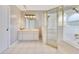 Bathroom featuring a glass enclosed shower, tiled floor, and updated vanity at 6555 Bay Tree Ct, St Cloud, FL 34771