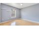 Bedroom with hardwood flooring, a ceiling fan and a bright window at 6555 Bay Tree Ct, St Cloud, FL 34771