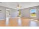 Spacious bedroom with hardwood floors, light gray walls, and a view of an adjacent bathroom at 6555 Bay Tree Ct, St Cloud, FL 34771