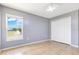 Cozy bedroom with a large window offering natural light and a spacious closet at 6555 Bay Tree Ct, St Cloud, FL 34771
