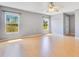 Spacious bedroom with lots of natural light, a ceiling fan, and hardwood floors at 6555 Bay Tree Ct, St Cloud, FL 34771