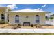 Charming home with decorative accents and a cozy front bench, creating a welcoming curb appeal at 6555 Bay Tree Ct, St Cloud, FL 34771