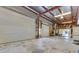Large, bright garage with two roll-up doors offers ample vehicle and storage space at 6555 Bay Tree Ct, St Cloud, FL 34771