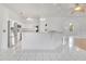 Bright, all-white kitchen featuring tile floors, modern appliances and an open layout at 6555 Bay Tree Ct, St Cloud, FL 34771