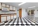 Kitchenette boasts checkerboard flooring and functional cabinetry at 6555 Bay Tree Ct, St Cloud, FL 34771