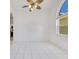 The living room features tile flooring, light walls and a ceiling fan at 6555 Bay Tree Ct, St Cloud, FL 34771
