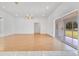 Spacious living room with hardwood floors and sliding glass doors to the outside at 6555 Bay Tree Ct, St Cloud, FL 34771