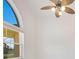 The living room features light walls, a ceiling fan, and large windows at 6555 Bay Tree Ct, St Cloud, FL 34771