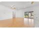 Open living area featuring light wood floors and view of the screened-in porch at 6555 Bay Tree Ct, St Cloud, FL 34771