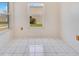 Room with tile flooring and a window view of a nearby structure at 6555 Bay Tree Ct, St Cloud, FL 34771