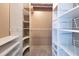 Walk-in closet with built-in shelving and hanging racks, offering ample storage space at 6555 Bay Tree Ct, St Cloud, FL 34771