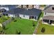 Well-manicured backyard with a fenced perimeter, lush green lawn, and a covered patio perfect for outdoor living at 685 Overpool Ave, Davenport, FL 33896