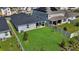 Spacious backyard featuring a lush lawn, fenced perimeter, and a patio, ideal for outdoor entertaining at 685 Overpool Ave, Davenport, FL 33896