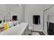 Bright bathroom featuring a shower, vanity, and essential toiletries at 685 Overpool Ave, Davenport, FL 33896