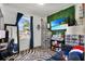 Unique bedroom featuring zebra rug, shoe displays, and vibrant greenery at 685 Overpool Ave, Davenport, FL 33896