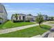 Beautiful single-story home with manicured landscaping and lush green lawn at 685 Overpool Ave, Davenport, FL 33896