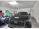 Organized garage featuring an automobile and ample storage space at 685 Overpool Ave, Davenport, FL 33896