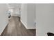 Hallway that features wood floors and lots of natural light at 685 Overpool Ave, Davenport, FL 33896