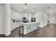 Modern kitchen with white cabinets, stainless steel appliances, and a large island at 685 Overpool Ave, Davenport, FL 33896