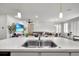 Modern kitchen sink with double basin and stainless steel faucet, open to a spacious living area at 685 Overpool Ave, Davenport, FL 33896