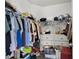 Spacious walk-in closet with ample storage space and organized shelving for clothes and accessories at 685 Overpool Ave, Davenport, FL 33896