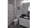 Bathroom with shower and a vanity with black countertop at 8101 Coconut Palm Way # 303, Kissimmee, FL 34747