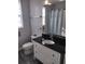 Cozy bathroom featuring black countertop and a shower at 8101 Coconut Palm Way # 303, Kissimmee, FL 34747