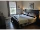 Comfortable bedroom featuring a large window and stylish decor at 8101 Coconut Palm Way # 303, Kissimmee, FL 34747