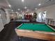 Spacious game room featuring a pool table, ping pong table, and various arcade games for community fun at 8101 Coconut Palm Way # 303, Kissimmee, FL 34747