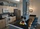 Cozy kitchen with stainless steel appliances, granite counters, bar seating, and pendant lighting at 8101 Coconut Palm Way # 303, Kissimmee, FL 34747