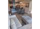 Open concept living room with modern furnishings and adjacent dining area with plenty of natural light at 8101 Coconut Palm Way # 303, Kissimmee, FL 34747