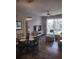 Inviting living room featuring a sliding glass door to the balcony and a dining area with a glass table at 8101 Coconut Palm Way # 303, Kissimmee, FL 34747
