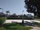 Community sand volleyball court with picnic tables in a lush outdoor setting at 8101 Coconut Palm Way # 303, Kissimmee, FL 34747